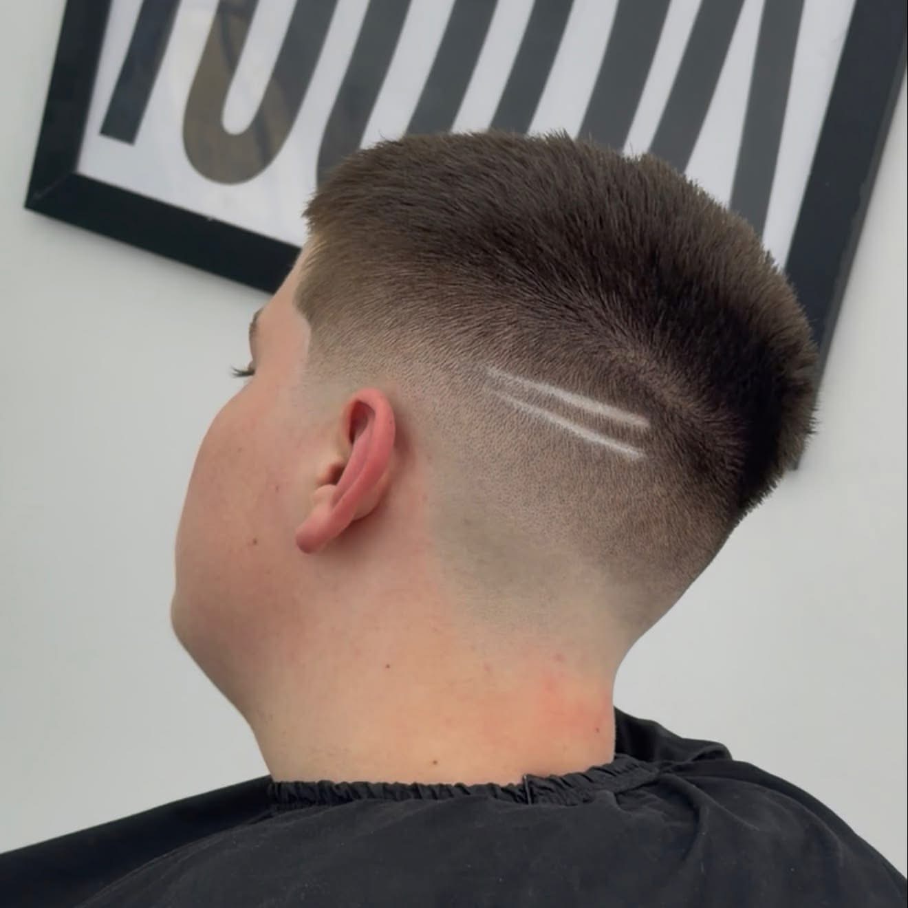 Skin fade with two shaved lines