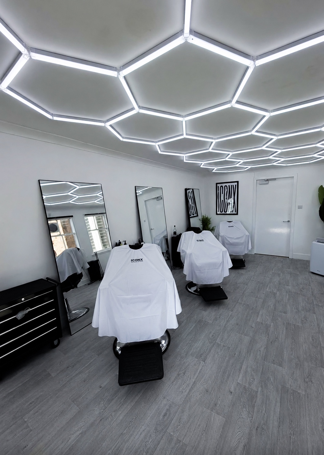 Barber chairs inside ICONX Men’s Hair Studio